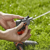Comfort-Full-or-Part-Circle-Pulse-Sprinkler-Spike-man-adjusting-sprinkler.png