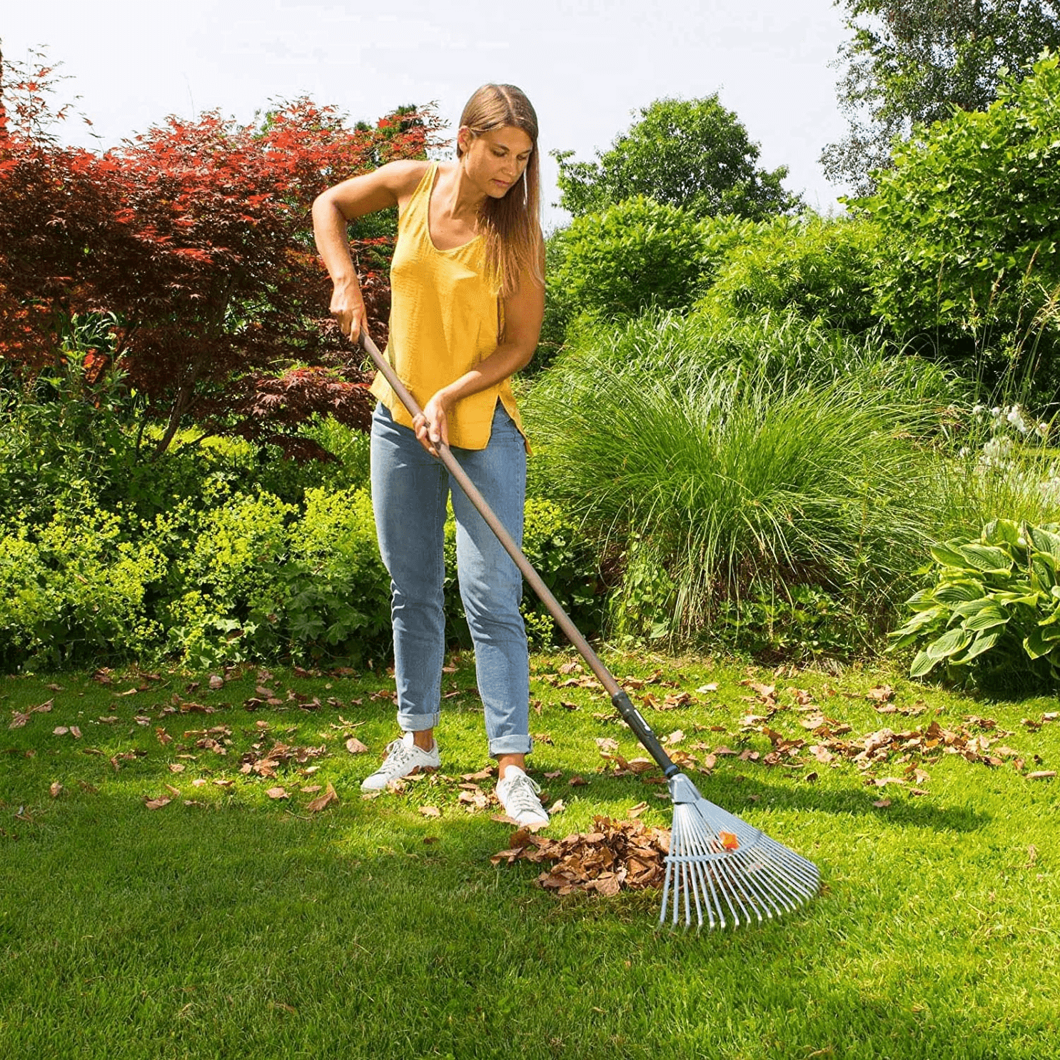 NatureLine-Adjustable-Rake-woman-raking.png
